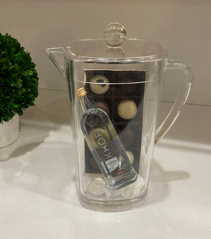 Engraved Lucite pitcher filled with Mishloach Manos